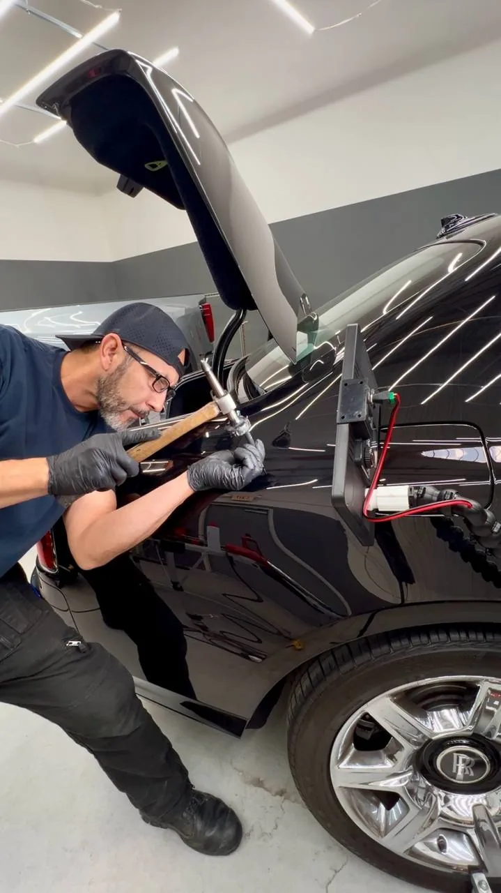 Paintless dent repair on a Rolls Royce in Upland, California