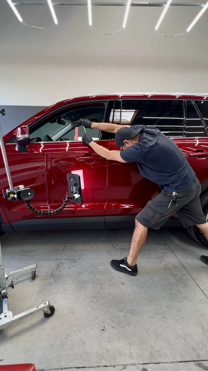 Paintless dent repair on an SUV at Dent Evo, Upland California