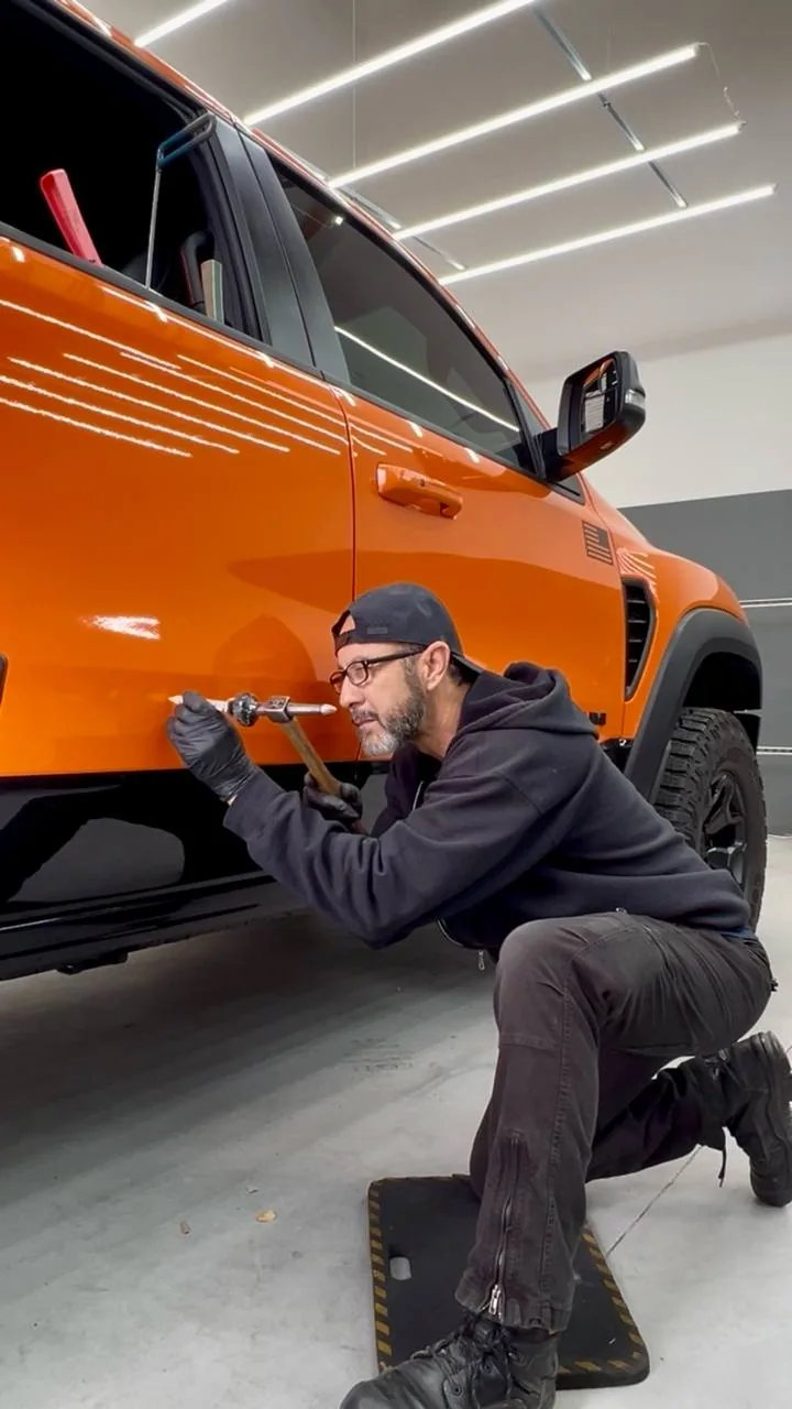 Paintless dent repair on a truck door at Dent Evo, Upland California